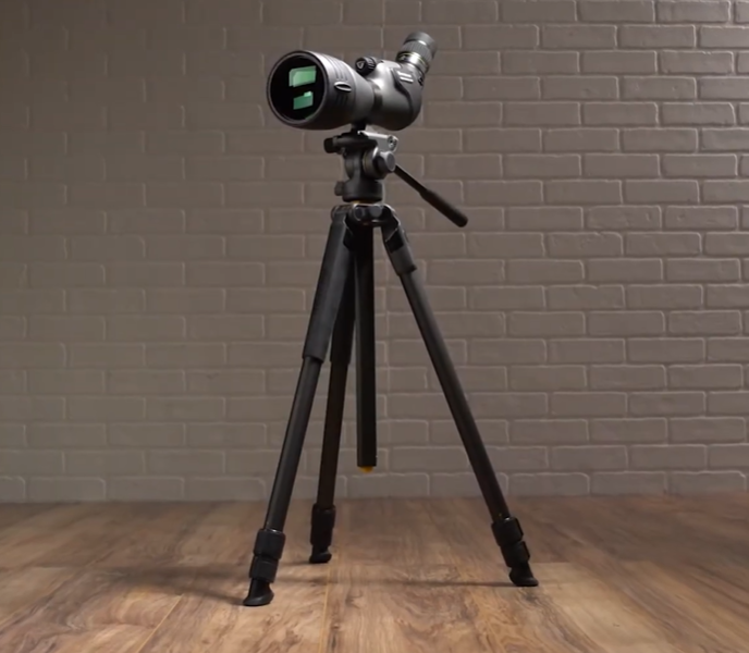Vanguard Alta Pro 2+ 263CB 100 Carbon Fiber Tripod set up on a wooden floor with a mounted scope in a studio background.