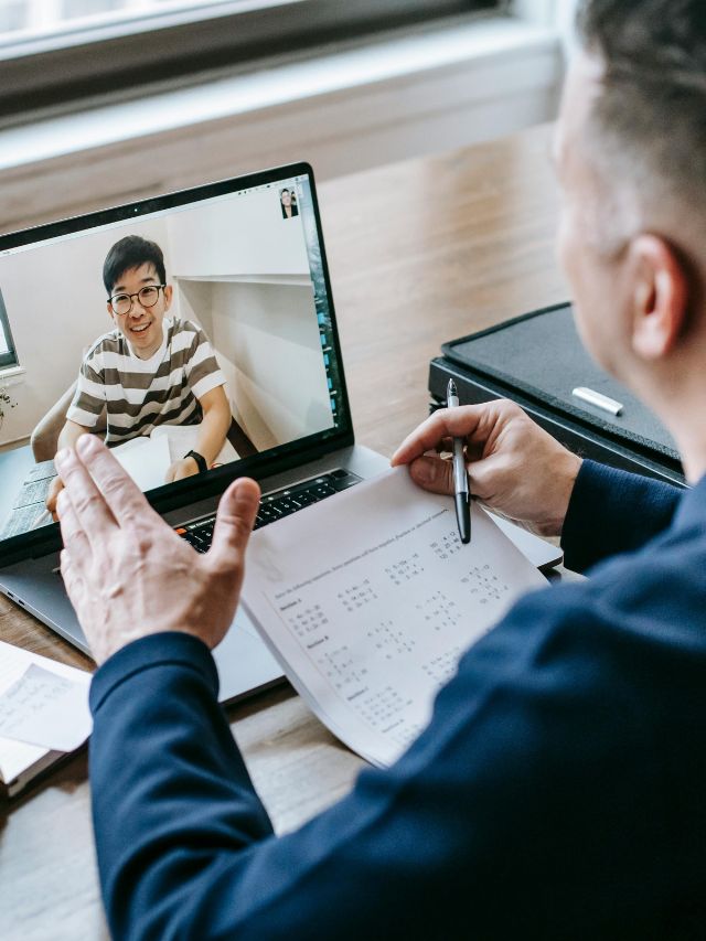 Mentor and mentee in an online video session discussing career growth through digital mentorship.