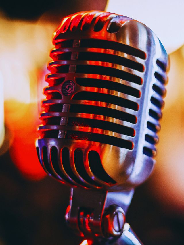 Retro microphone with colorful lights symbolizing the AI revolution in music industry